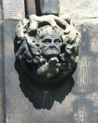 Carved hood moulding stop